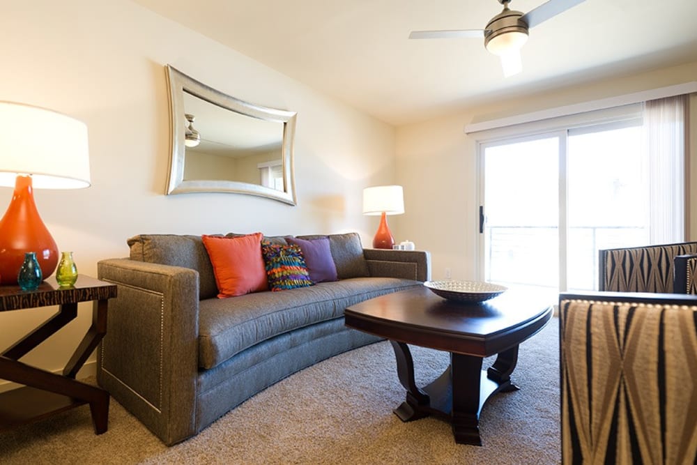 Living room with doors to balcony at Lakewood Park Apartments in Lexington, Kentucky