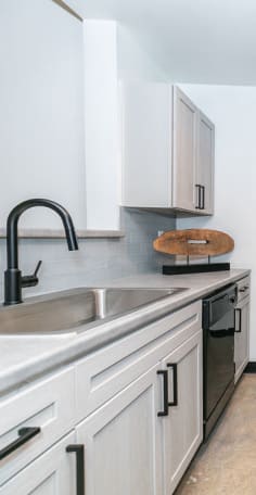 Kitchen with concrete floors at Lofts at Riverwalk in Columbus, Georgia