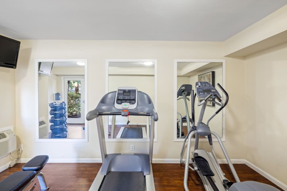 Clean and comfortable gym area at Montecito Apartments in Santa Clara, California