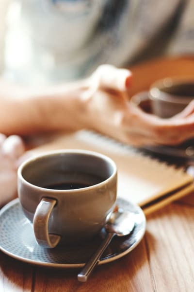 Residents enjoy a good conversation over coffee near Alura, Woodland Hills, California 