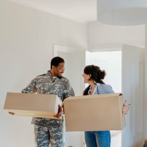 A service-member and partner moving into their new apartment in Paramount, California