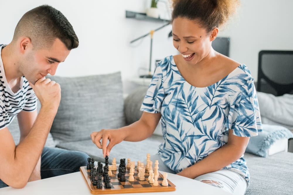 Residents playing a game of chess in the clubhouse at Meadow Wood Apartments in Smyrna, Tennessee