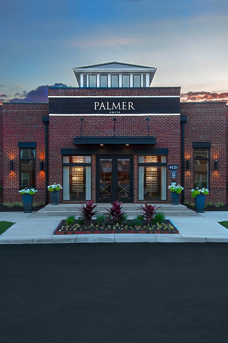 Exterior of Palmer House Apartment Homes on a sunny spring day in New Albany, Ohio
