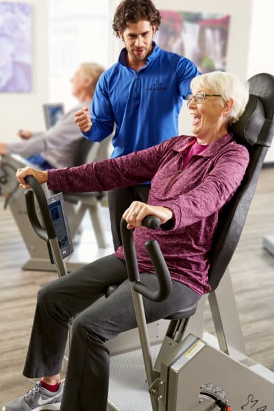 Resident using HUR fitness equipment at Quail Park at Morrison Ranch in Gilbert, Arizona