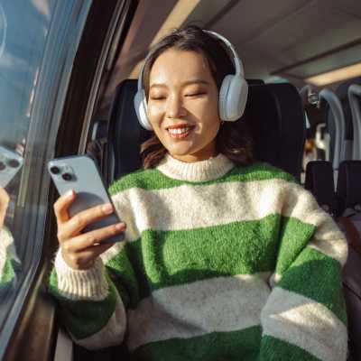Woman listening songs in local train at The Marling in Madison, Wisconsin