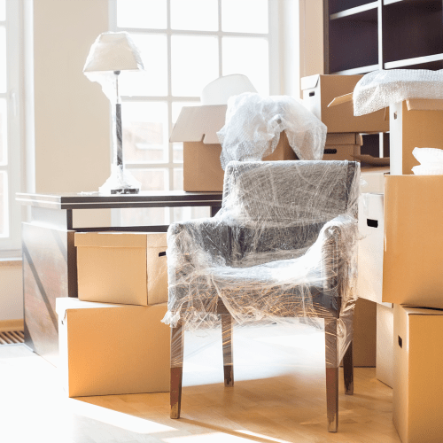 Wrapped furniture and moving boxes near A-American Self Storage in Lancaster, California