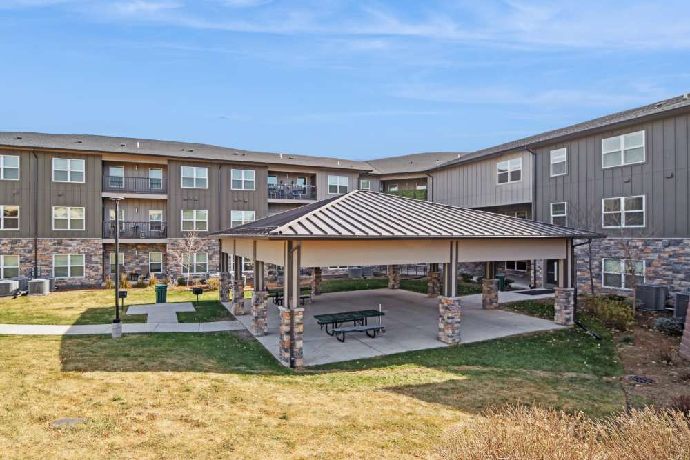 An apartment with lush greenery at Villas At Mesa Ridge in Fountain,Colorado