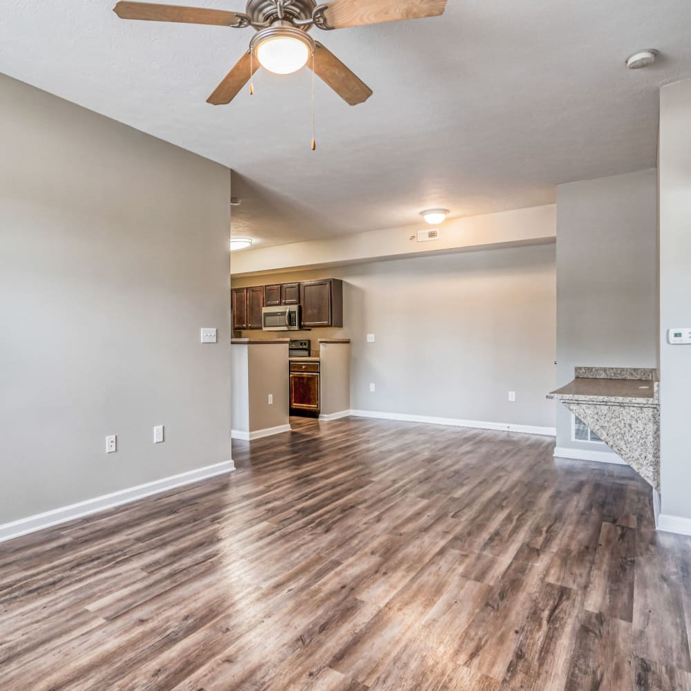 Spacious apartment with wood-style flooring and ceiling fan at 5700 Madison, Indianapolis, Indiana