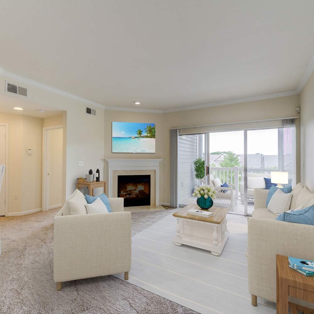 Inviting living space with a cozy fireplace and bright natural light at Boulder Springs in Maryland Heights, Missouri.