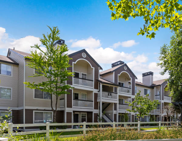 Exterior building with greenery landscaping at Olin Fields Apartments in Everett