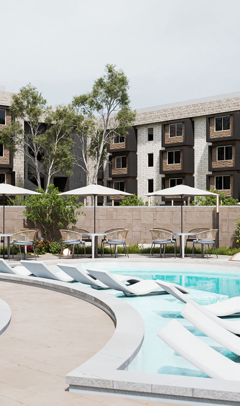 Swimming pool with loungers at Stone Village Apartments in Reno, Nevada
