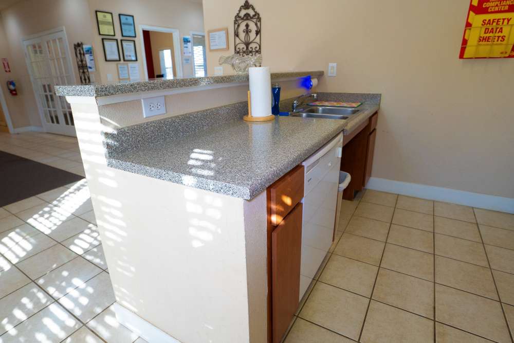 Granite countertops of community kitchen and breakfast bar at Millpoint Townhomes in Henderson, Texas
