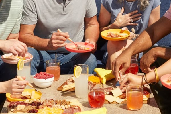 Friends eating and drinking colorful drinks near Las Casas at Windrose in Litchfield Park, Arizona
