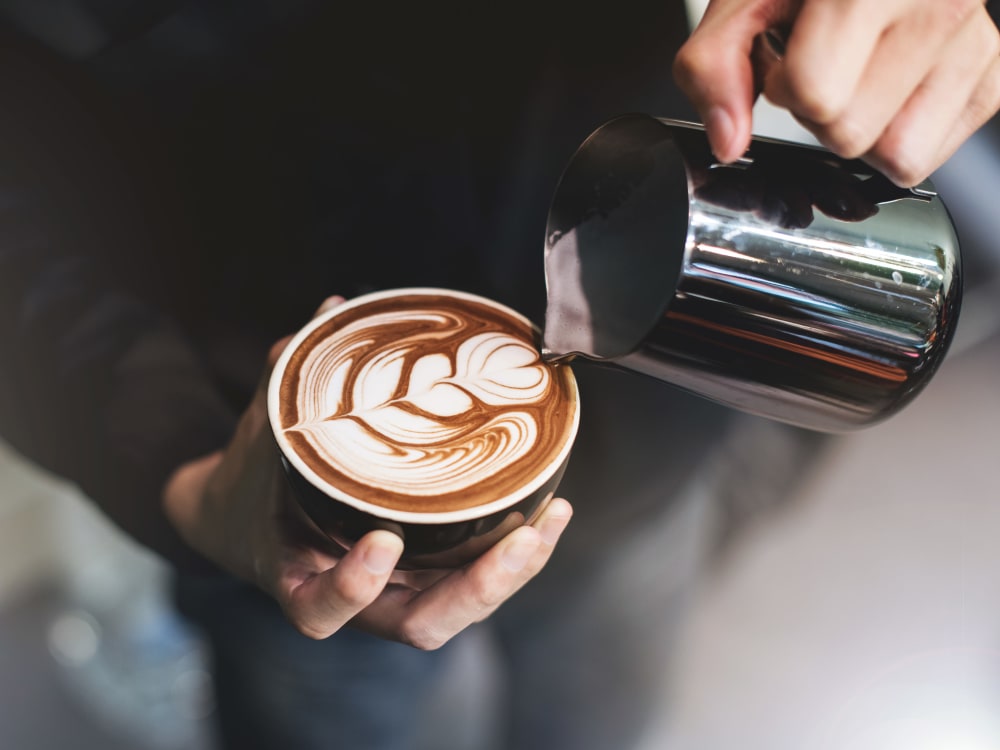Barista making a latté for a customer near Haven New Providence in New Providence, New Jersey
