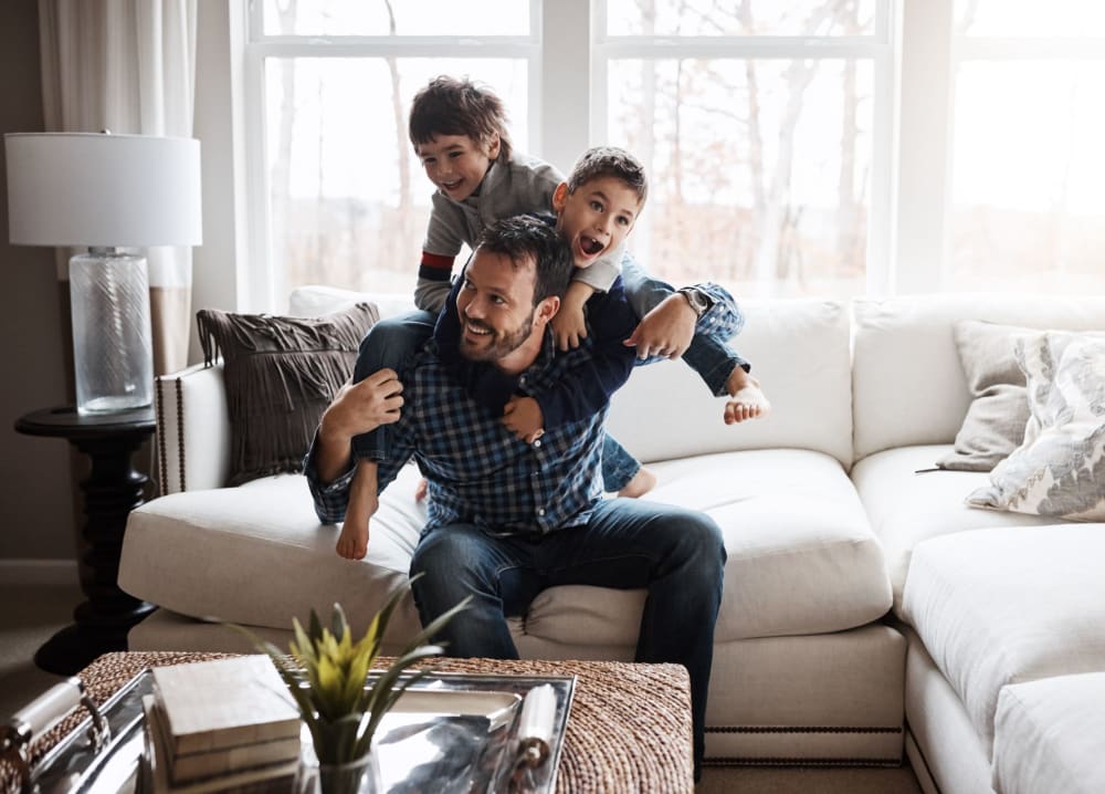 A resident playing with his kids at The Residences at Annapolis Junction in Annapolis Junction, Maryland