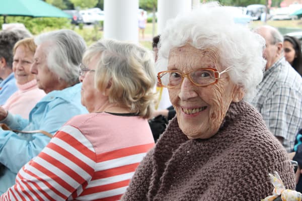 Resident at an event smiling at the camera at The Birches at Harleysville in Harleysville, Pennsylvania