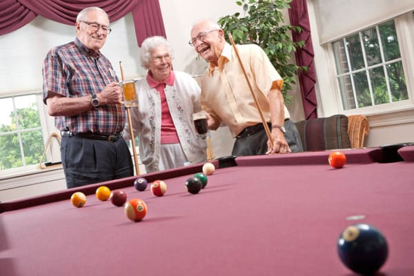 Residents hanging out together at the bar at Senior Commons at Powder Mill in York, Pennsylvania