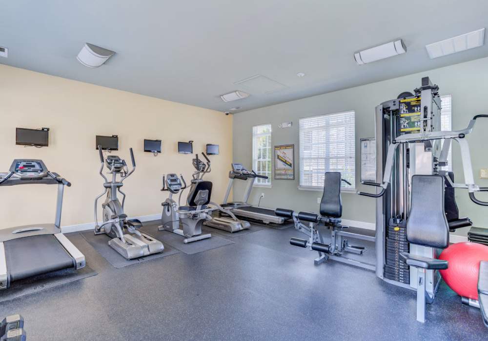 Well-equipped fitness center with treadmills and weight-lifting machines at Innisbrook Village in Greensboro, North Carolina