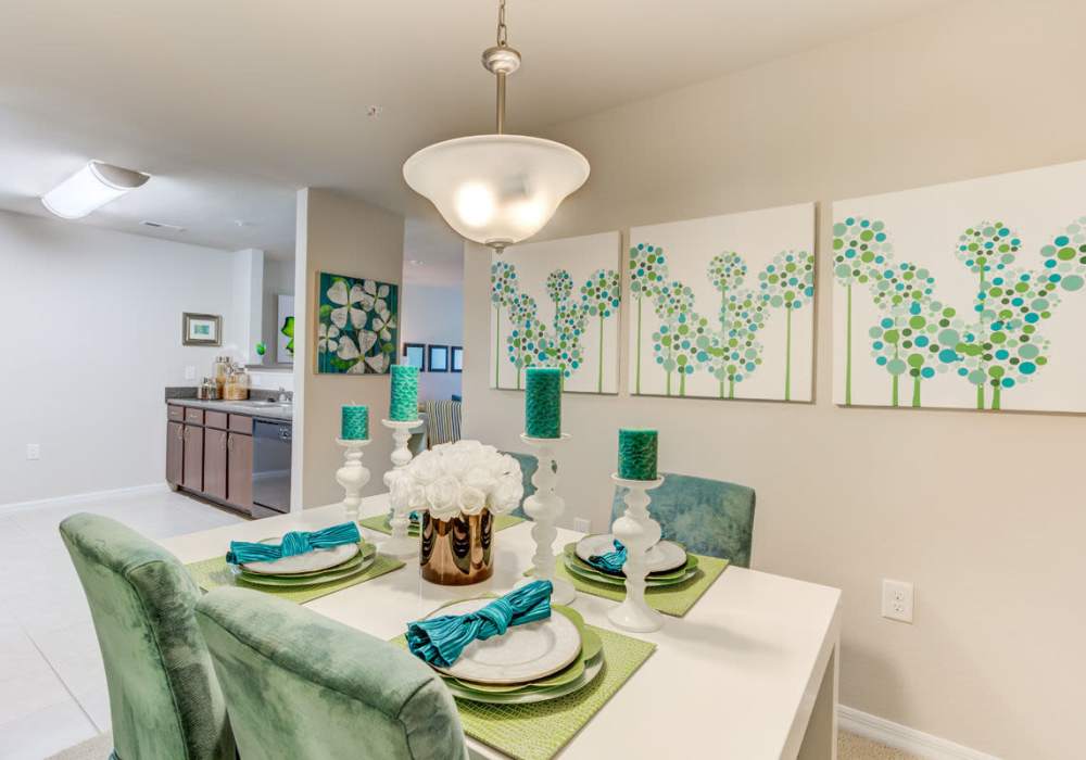 Kitchen table in dining room with an open layout that connects to kitchen at Innisbrook Village in Greensboro, North Carolina