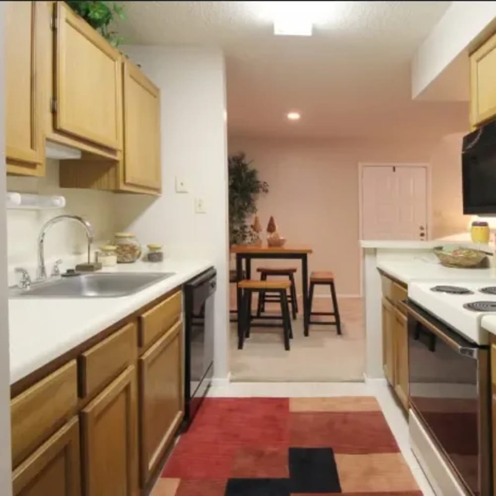 Kitchen with wooden cabinets at Edgewood in Baton Rouge, Louisiana