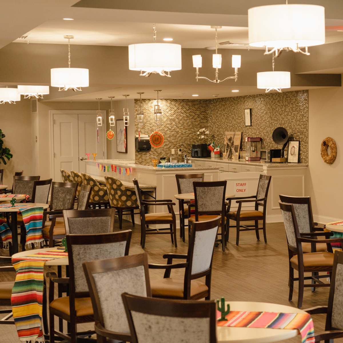 Dining area with lots of round tables and chairs at Harmony at Kent in Dover, Delaware