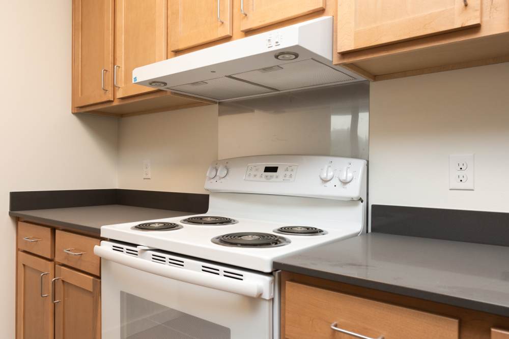 Energy-efficient appliances and wooden cabinets at Gardner House in Seattle,Washington