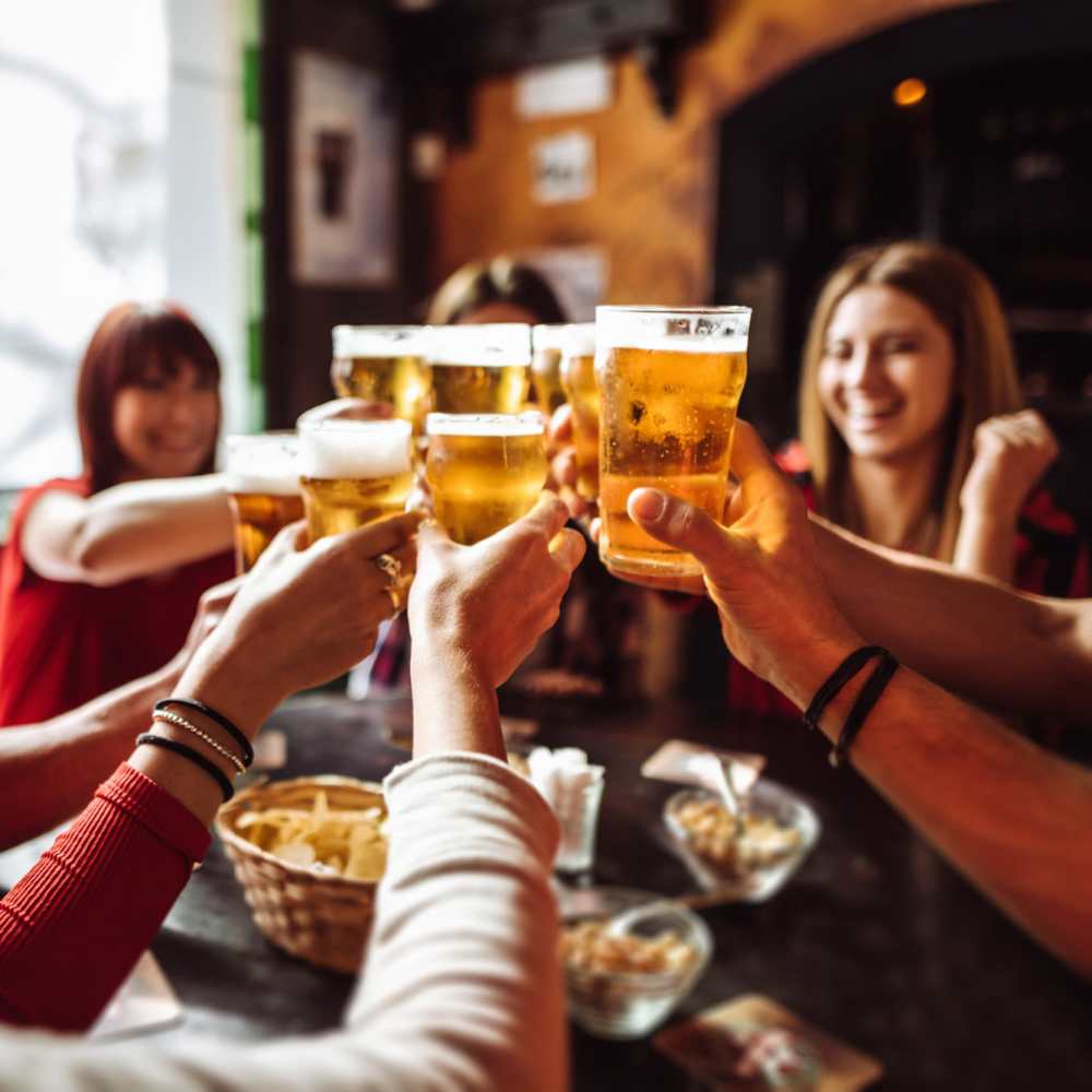 Residents toasting to the good life at their favorite night spot near Village Crest Apartment Homes in Smyrna, Tennessee