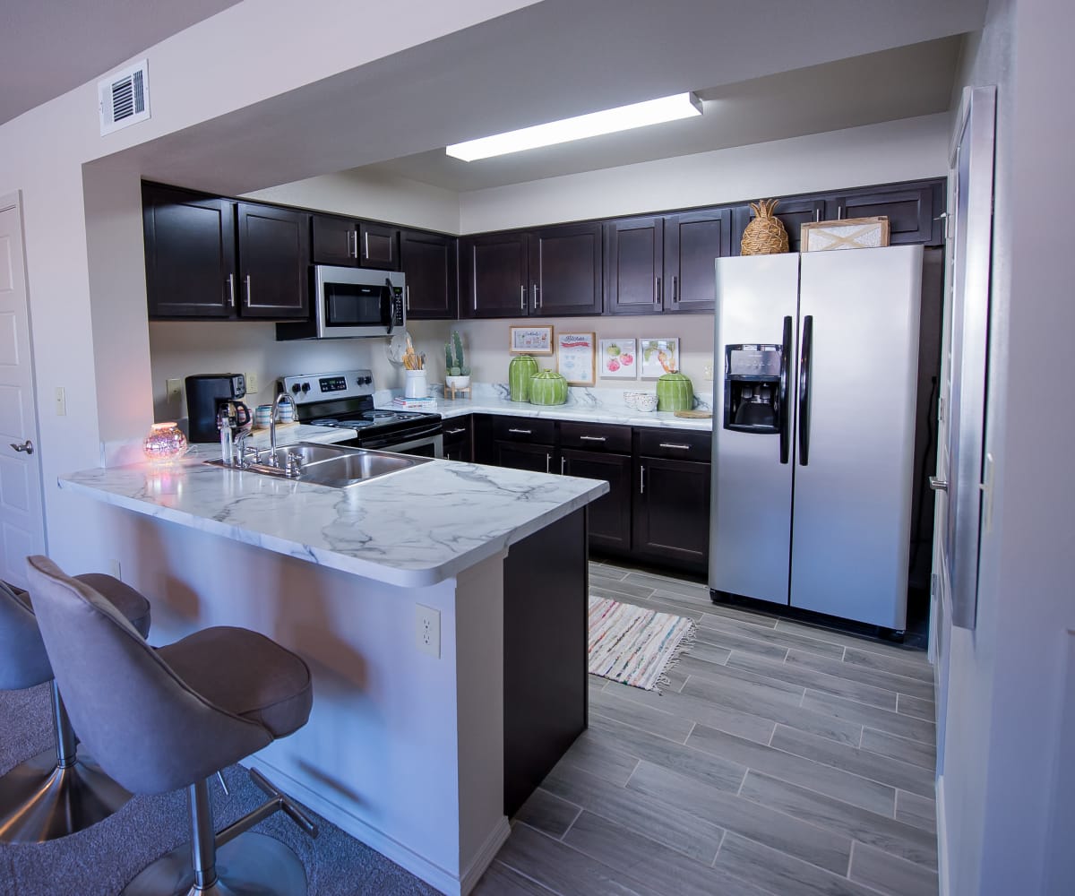 Kitchen with stainless steel appliances at Icon at Hewitt in Hewitt, Texas