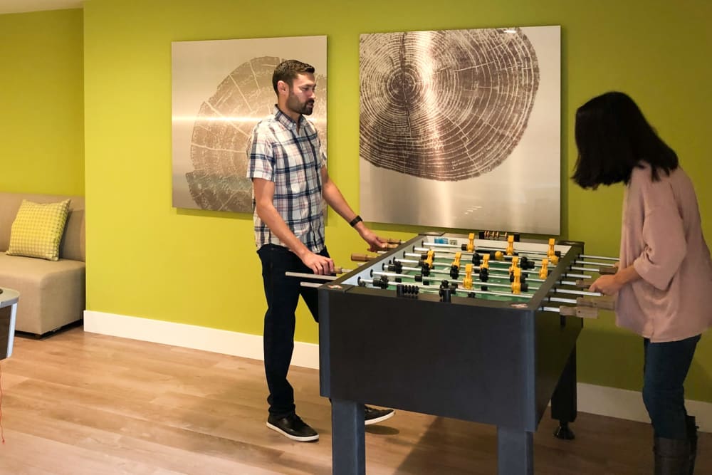 Residents playing foosball at Greendale Apartments in Mountain View, California