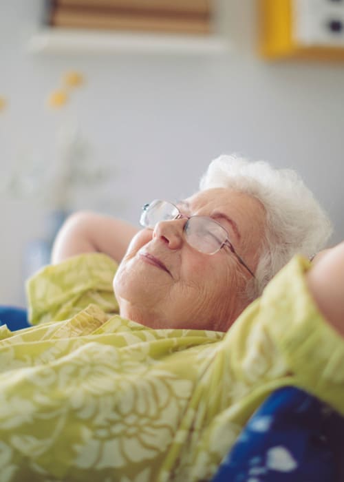 A resident lying down at Grand Villa Senior Living in Clearwater, Florida