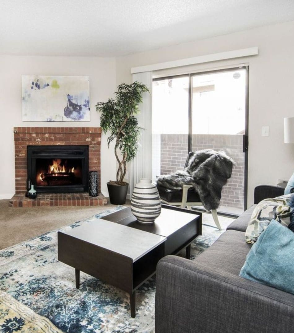 Cute living room with a nice fireplace to keep you warm at Sofi Belmar in Lakewood, Colorado