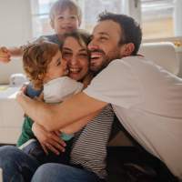 Happy resident family at Pine Oaks Apartments in Mesquite, Texas