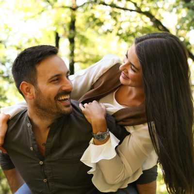 Resident couple enjoy in park near The Boulevard Apartment Homes in Woodland Hills, California