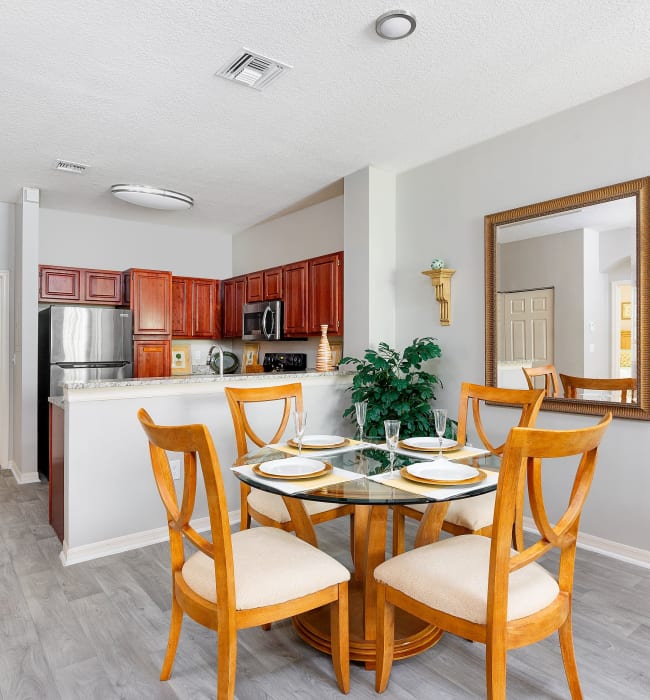 model kitchen and living room at Villas of Juno Apartments in Juno Beach, Florida