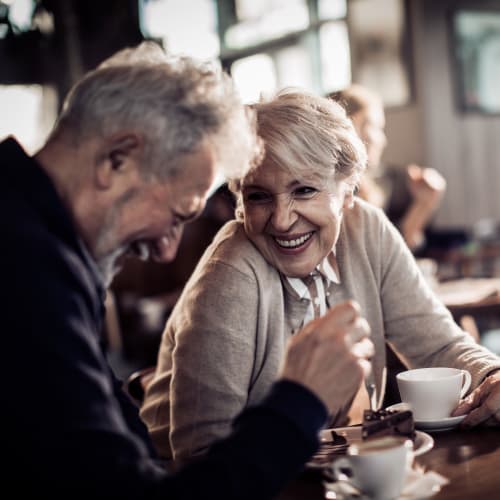 Resident out for a cup of coffee at a café near 21 West Street in New York, New York