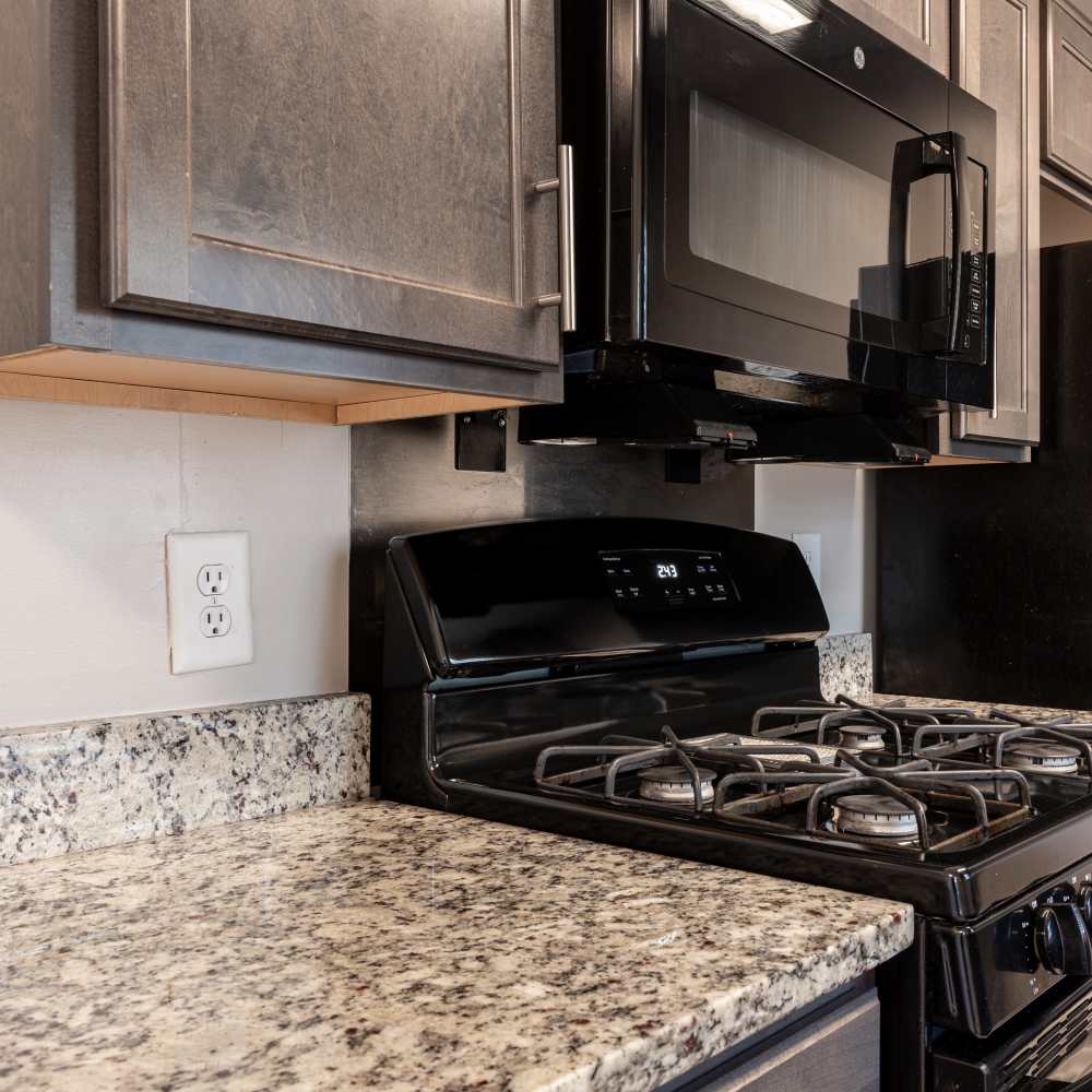 Modern kitchen with granite countertop at Park Vue Place in Richmond, Virginia