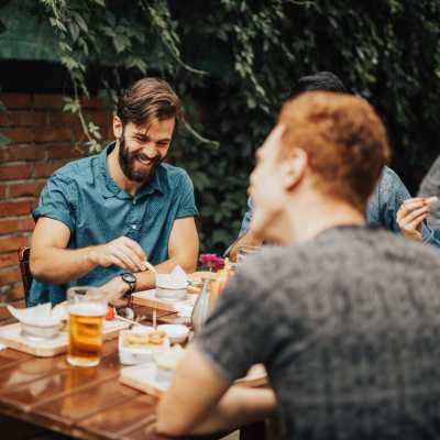 Resident having drinks with friends outside near Landmark at Dublin in Dublin, Pennsylvania