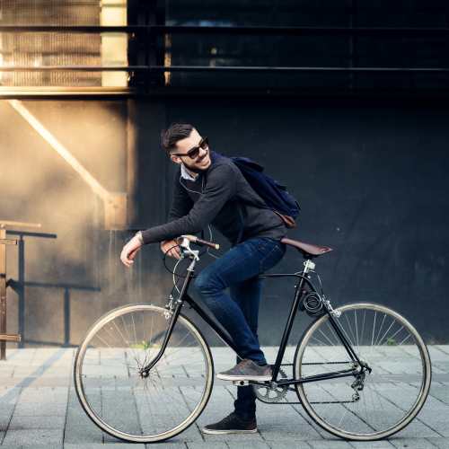 Man with his bike in downtown at Amber Court in Fremont, California