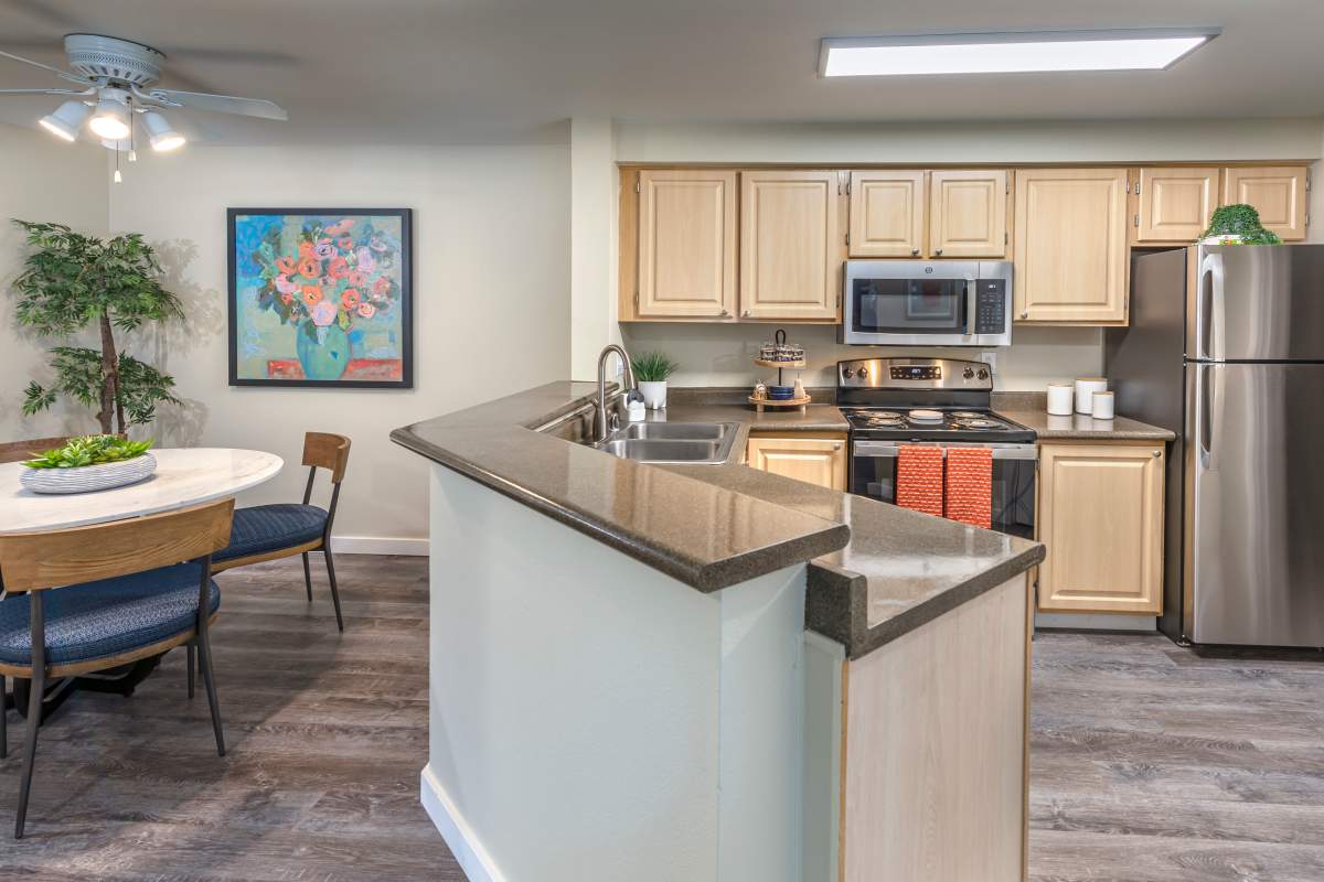 Kitchen and dining room area at Redmond Place Apartments in Redmond, Washington
