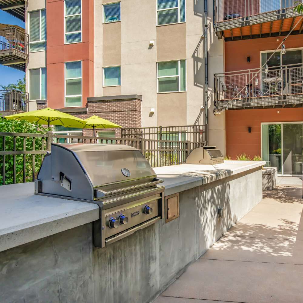 Outdoor barbeque area at Park Place Olde Town Apartments in Arvada, Colorado