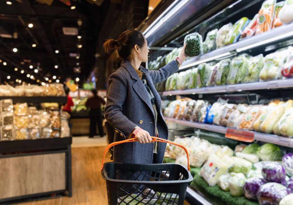 Resident with cart at a supermarket near Seapointe Villas in Costa Mesa, California 