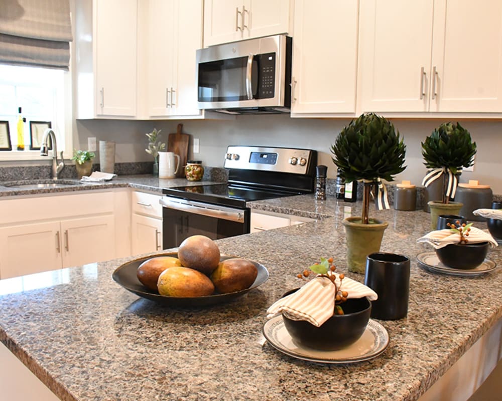 Beautiful kitchen with granite countertops at Eden and Main Apartments in Southington, Connecticut