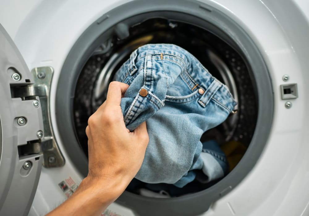 Person doing some laundry at St. Johns Landing Apartments in Green Cove Springs, Florida