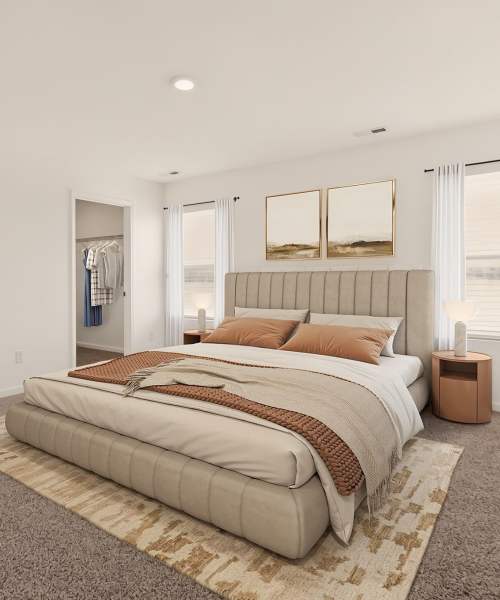 Bed with decorative pillow at Brixin Sonora in Fort Wayne, Indiana