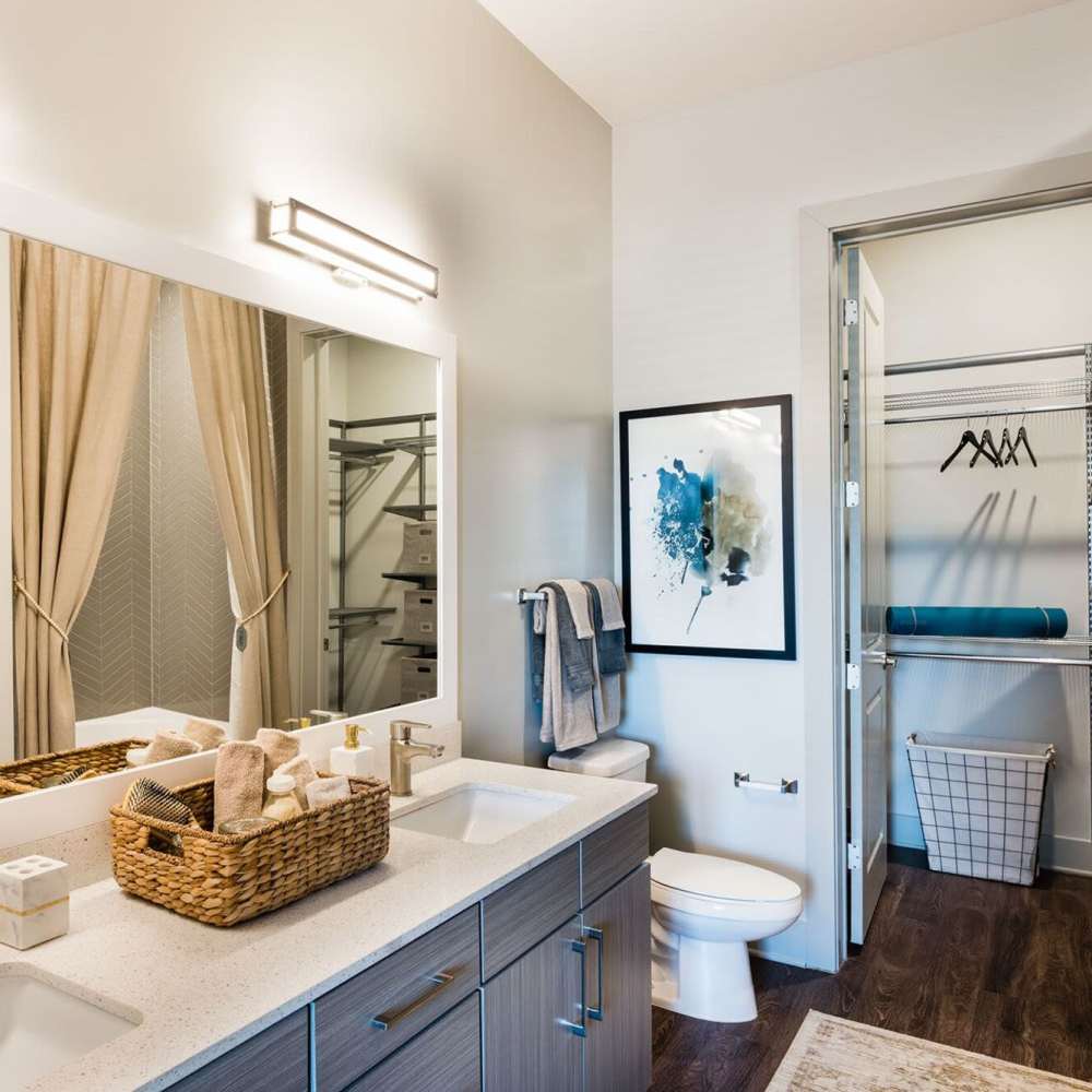 Well-maintained bathroom with a large mirror and a sink at Siena Suwanee Town Center in Suwanee, Georgia