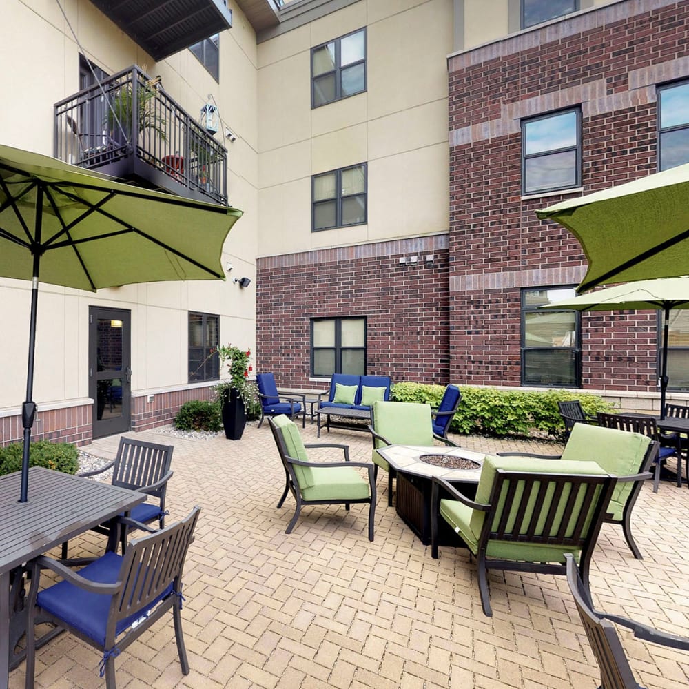 Adirondack chairs around the fire pit at Oaks Station Place in Minneapolis, Minnesota