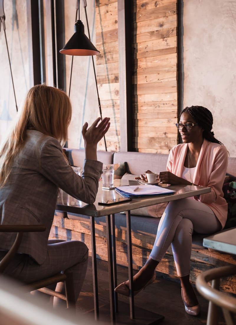 Resident having a business meeting at a local restaurant in Fort Worth, Texas from Marquis at Stonegate