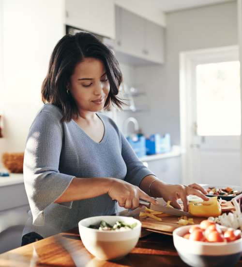 Resident cooking at The Courtyards Pacific Village in San Diego, California