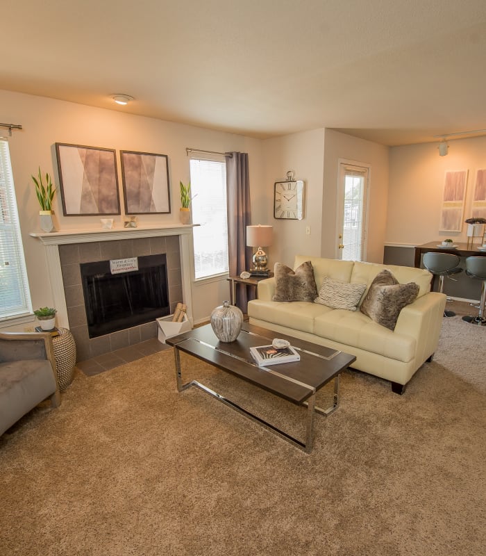 Carpeted living room at The Remington Apartments in Wichita, Kansas