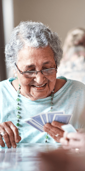 Resident playing a game of cards at Heritage Green in Mechanicsville, Virginia